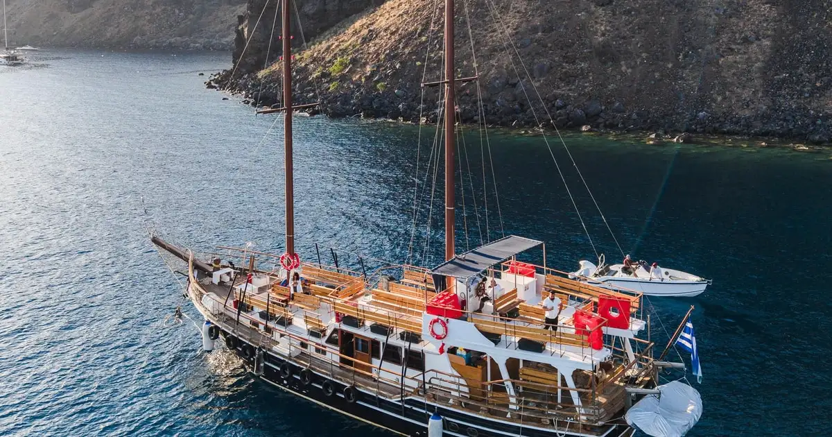 Thirassia harbour seen from a volcano and hot springs cruise, Santorini Greece