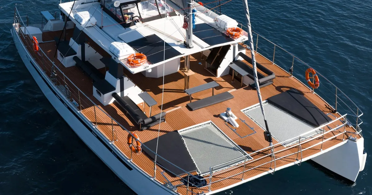 Catamaran sailing across the caldera on a cruise with meal and drinks, Santorini Greece